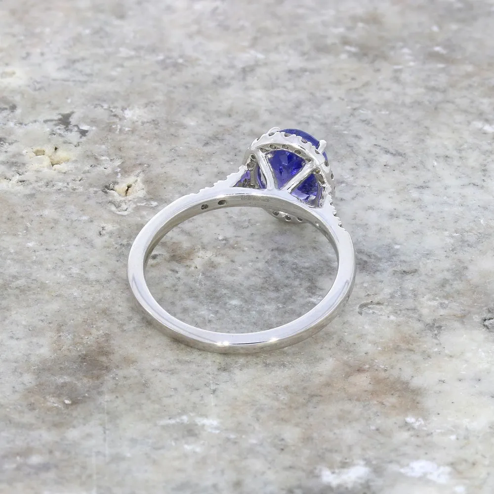 Pre Owned 9ct White Gold Oval Tanzanite and 0.20cts Diamond Halo Cluster Ring