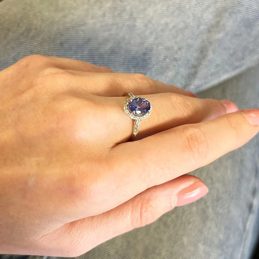 Pre Owned 9ct White Gold Oval Tanzanite and 0.20cts Diamond Halo Cluster Ring